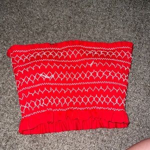 Red cropped fitted tube top.